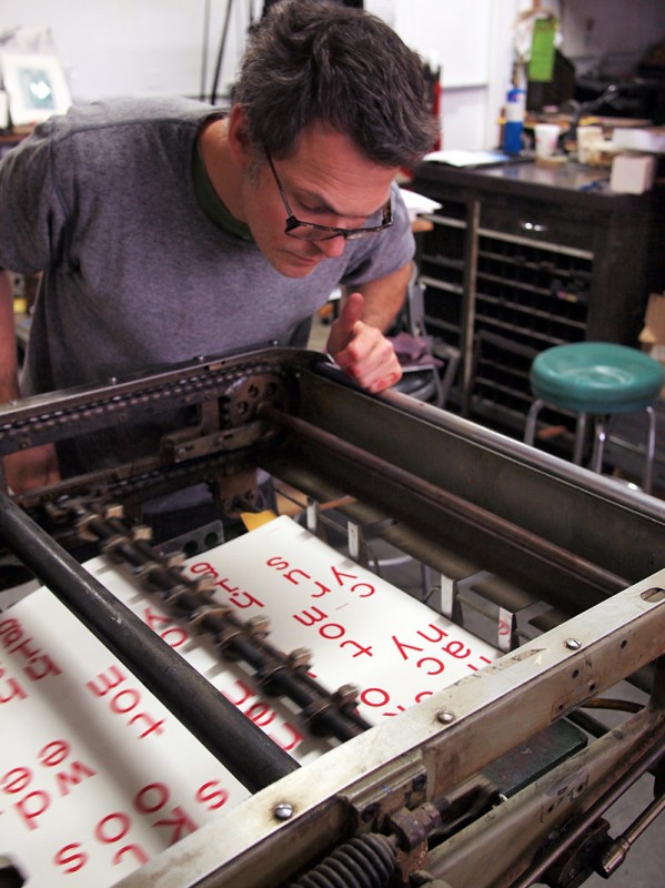 Dan Wood of DWRI Letterpess printing the poster and bookmarks